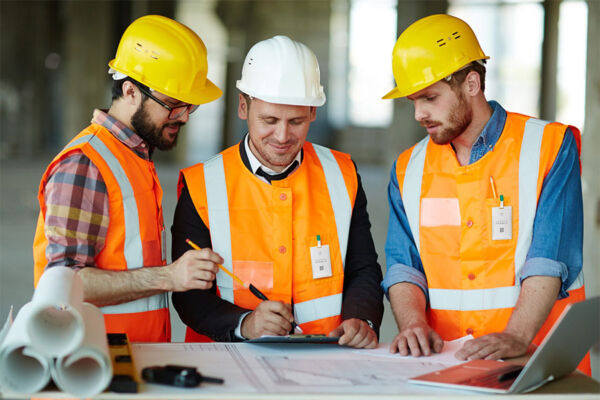 Contractors looking at the design plan.