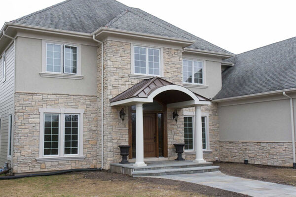 Stucco and stacked stone environmental friendly materials used on the house.