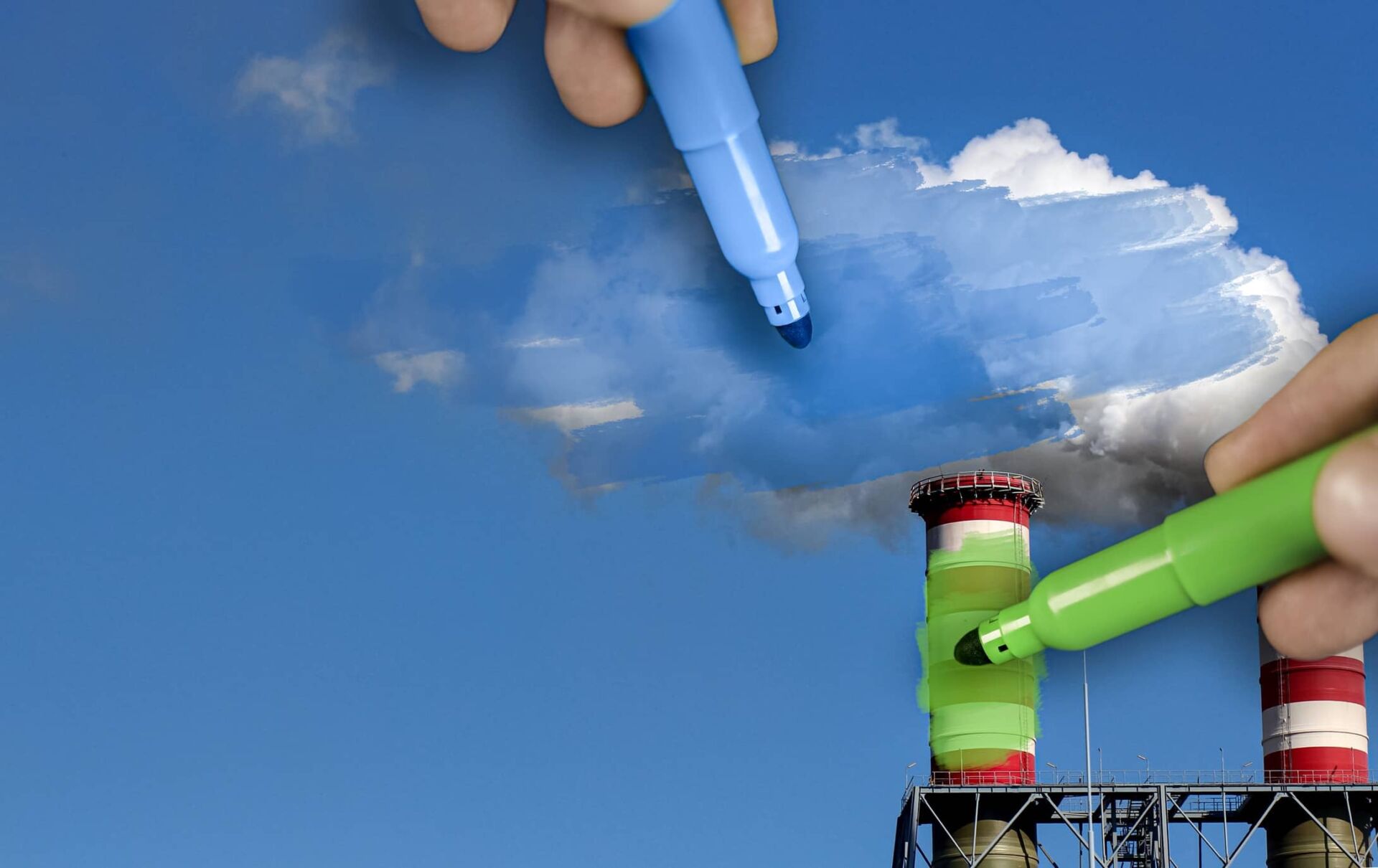 A person colors over a picture of refinery silos with green and blue markers.