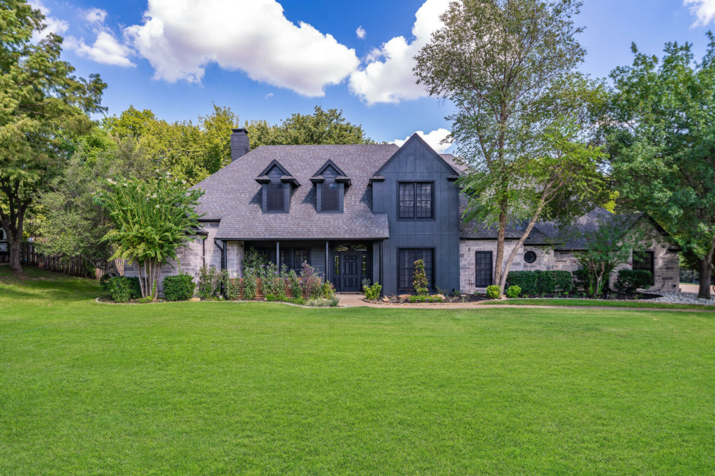 A dark house using StoneCoat products on a clear day