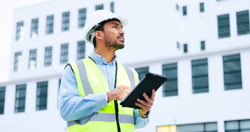 A male engineer checking data on his tablet